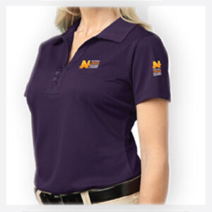 A woman wearing a purple University of Michigan polo shirt.