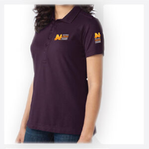 Woman wearing a dark purple polo shirt with orange logos on chest and sleeve.