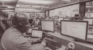 Incident command center with many people and computers.