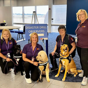 Four National Crisis Response Canine teams - handlers and their dogs.